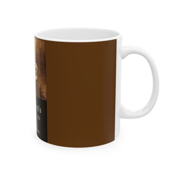 White coffee mug with brown design.