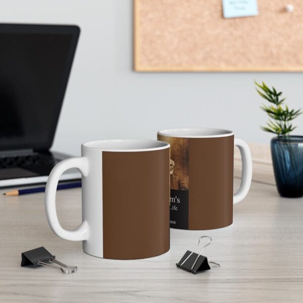 White coffee mug with a brown design.