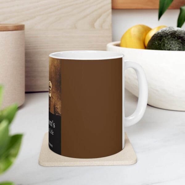 White coffee mug with brown design.