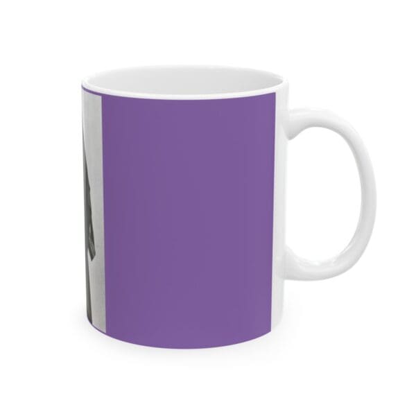 White mug with a purple design.