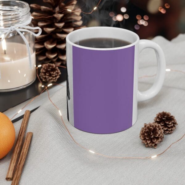 Purple coffee mug with hot beverage.