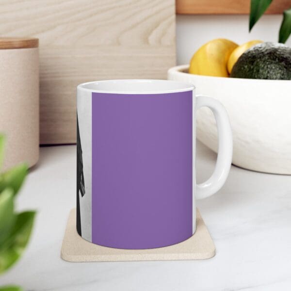 Purple mug with a black and white image.