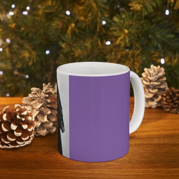 Purple mug with a black and white image.