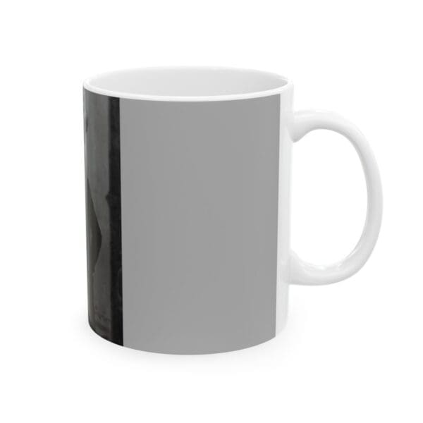 White coffee mug with gray design.