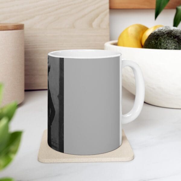 White mug with a black and white photo.