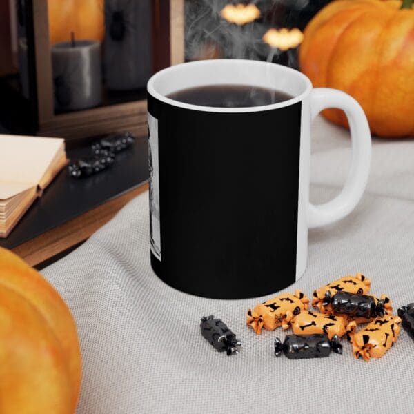 Black coffee mug with Halloween candies.