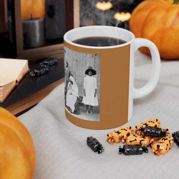 White mug with black and white photo of family.