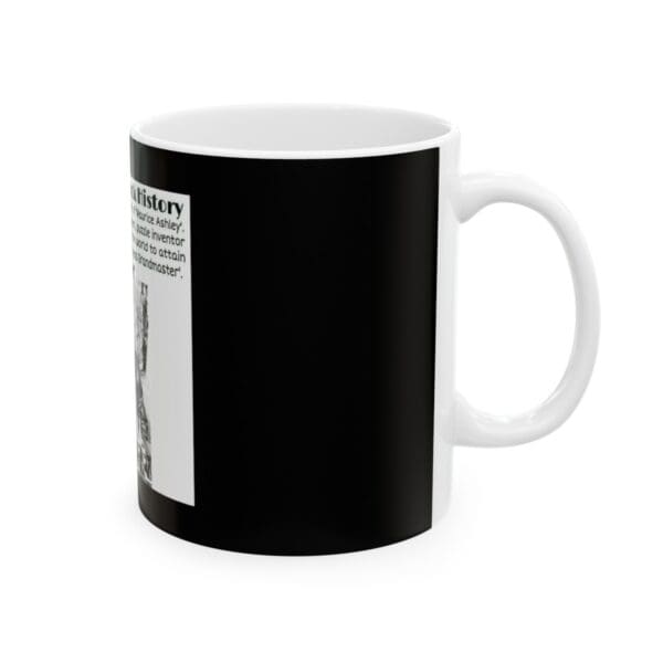 White mug with black design and text.