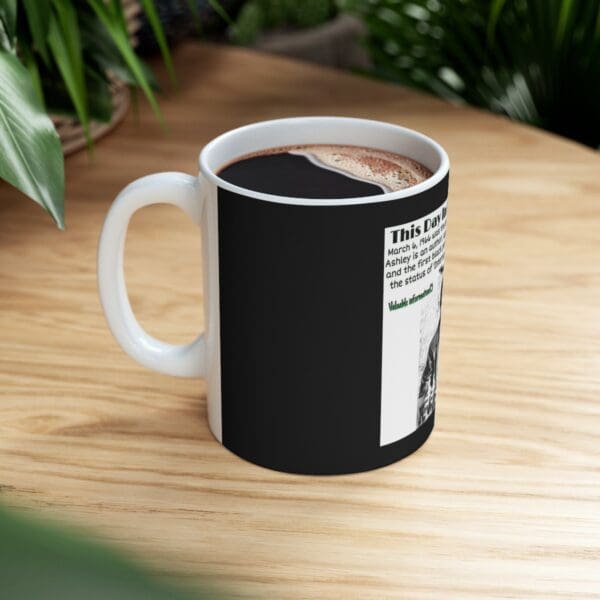 White mug with black text and a photo.