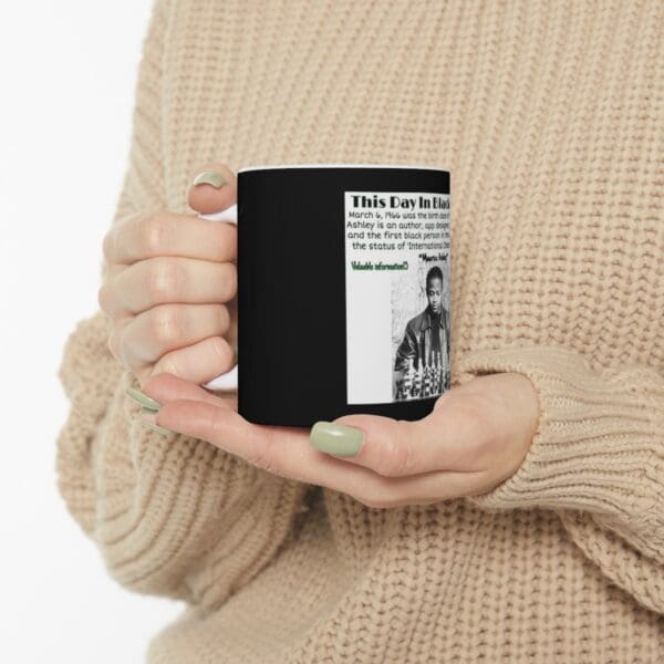 Black mug with text and image of a man.