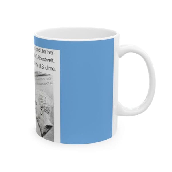 White mug with blue background and a dime.