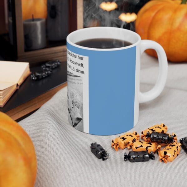 White mug with blue design and candy.