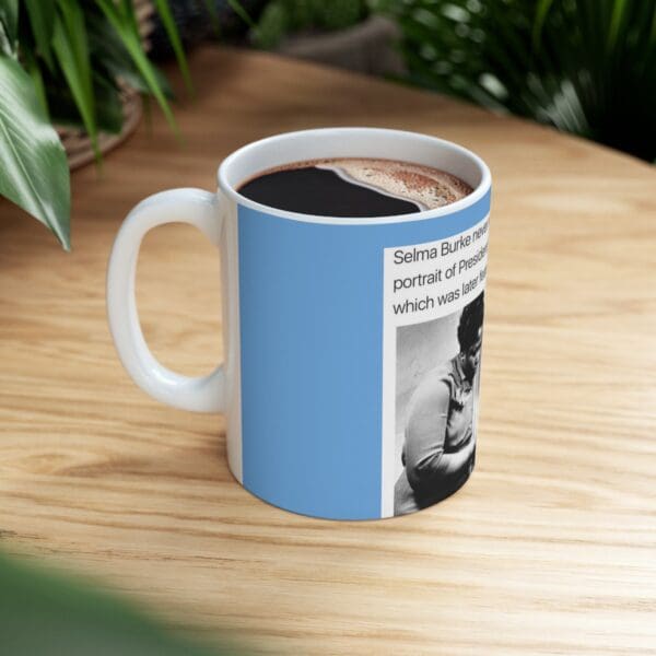 White mug with text and image of Selma Burke.