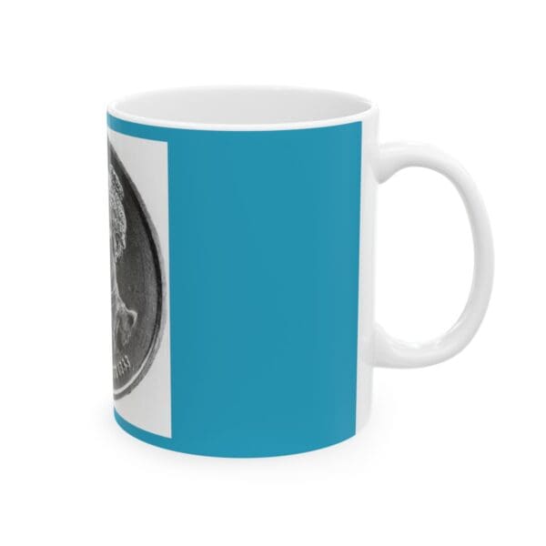 White coffee mug with a coin design.