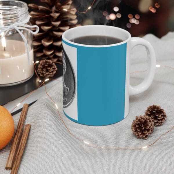 Blue mug with coin design and coffee.