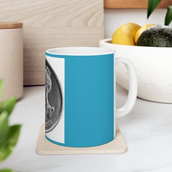 Blue mug with a coin design.