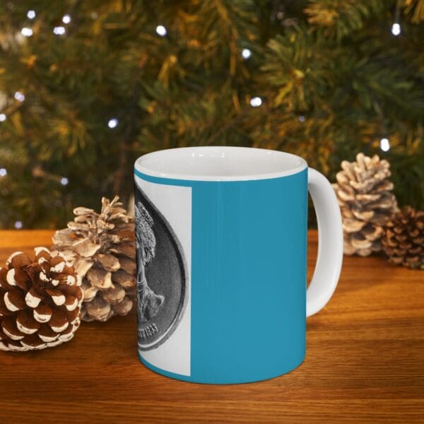 Blue mug with a coin design.