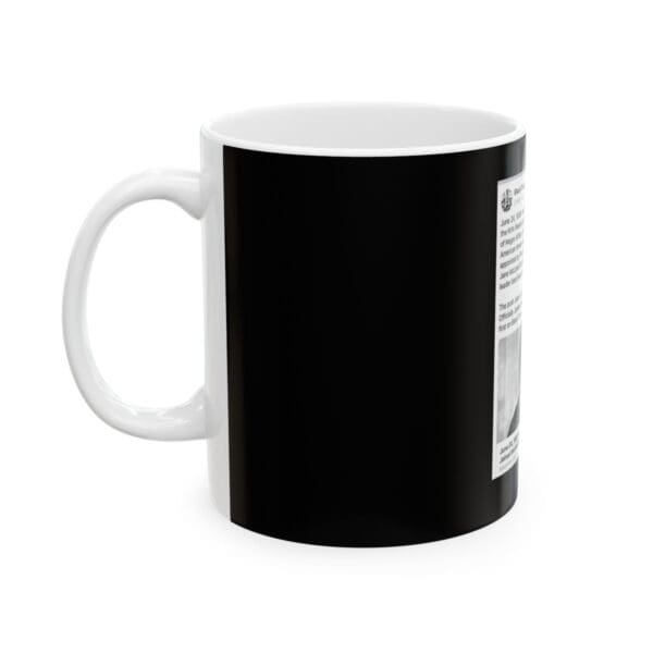 White mug with a black design.