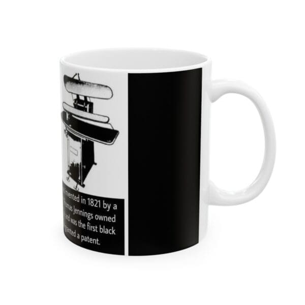 Black and white mug with a drawing of a machine on it.