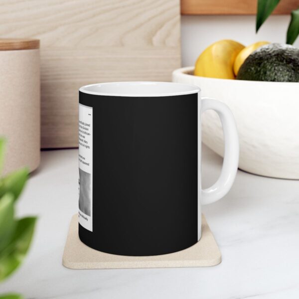 Black coffee mug with a quote on it.