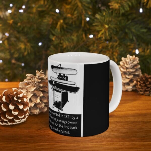 Black and white mug with ironing machine image.