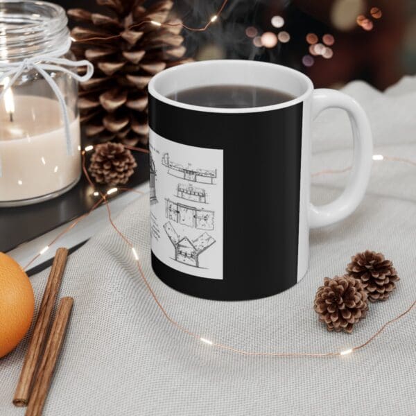 Black mug with a diagram of a bridge.