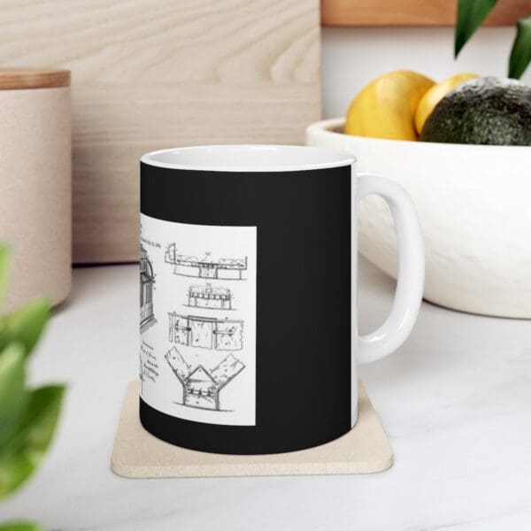 Black mug with a white drawing of a patent.