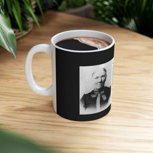 White coffee mug with a woman's portrait.