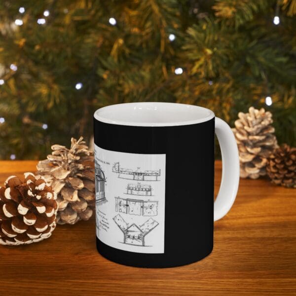 Black coffee mug with a vintage blueprint design.