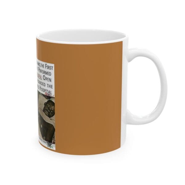 White mug with brown design and photo.