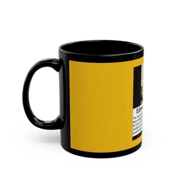 Black mug with yellow design and text.