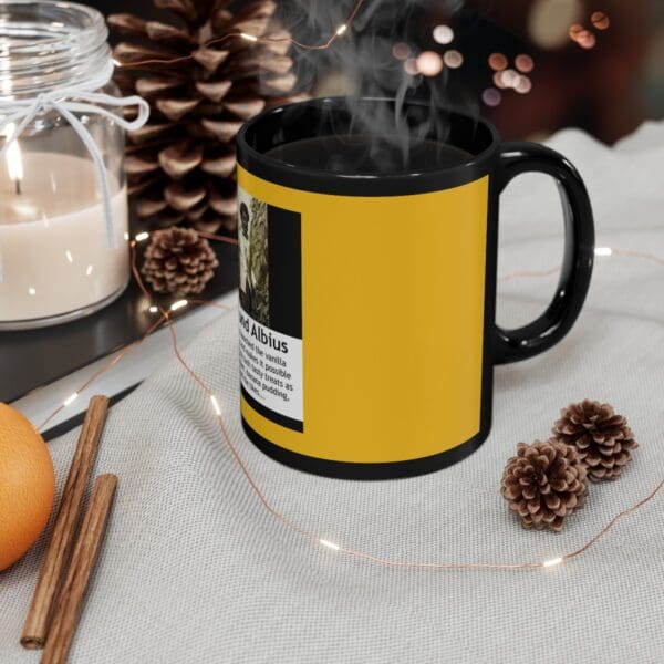 Black mug with yellow design and steam.