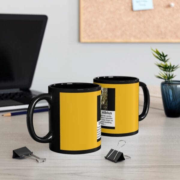 Black mug with yellow and white text.