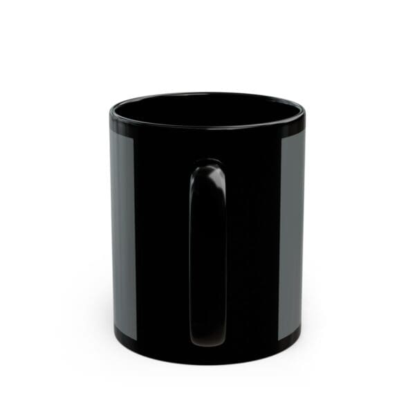 Black coffee mug with a handle.