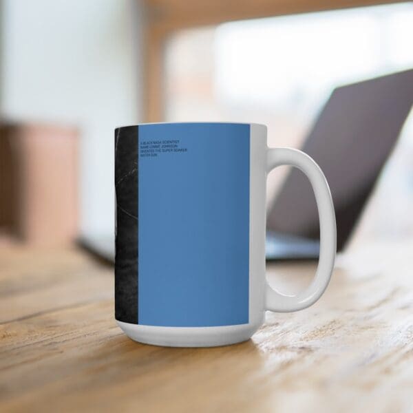 White coffee mug with blue and black design.