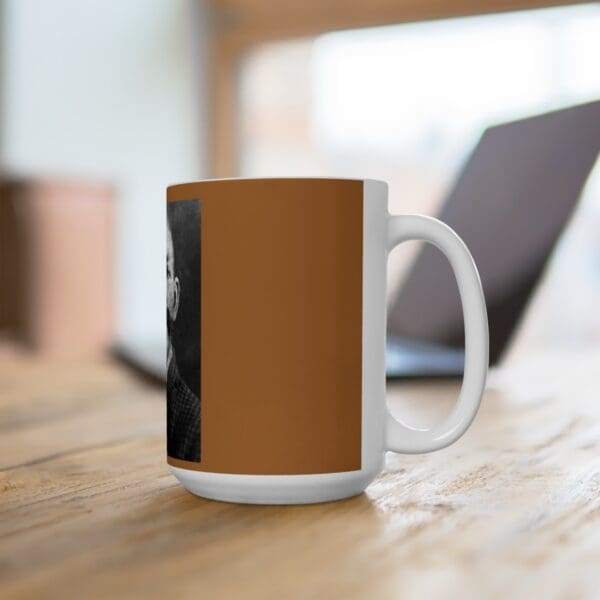 White mug with a man's face on it.