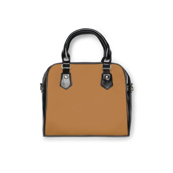 Black and brown handbag with gold hardware.