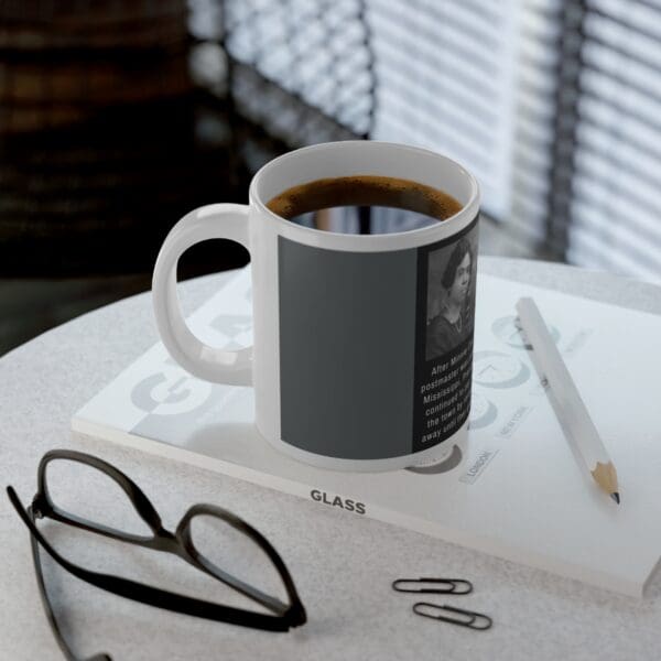 White mug with a black and white image of a woman.