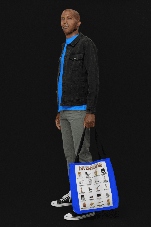 Man holding a tote bag with African American inventions.