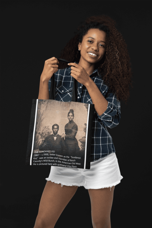 Woman holding a tote bag with The Sundance Kid photo.