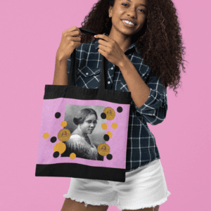 Woman holding a tote bag with a portrait.