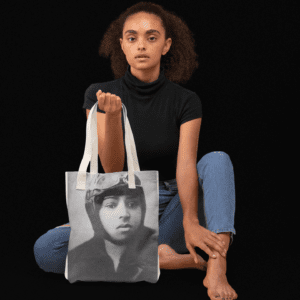 Woman holding tote bag with Bessie Coleman