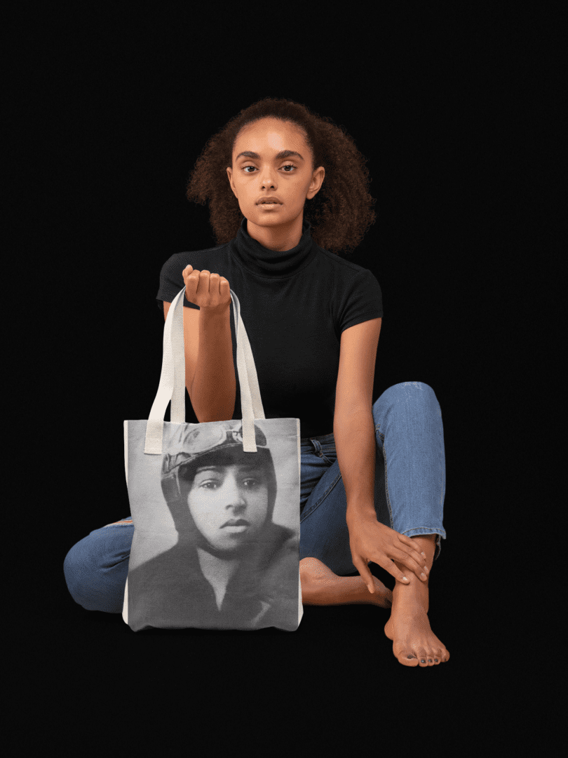 Woman holding tote bag with Bessie Coleman