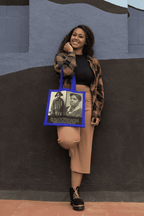 Woman holding a tote bag with a portrait.