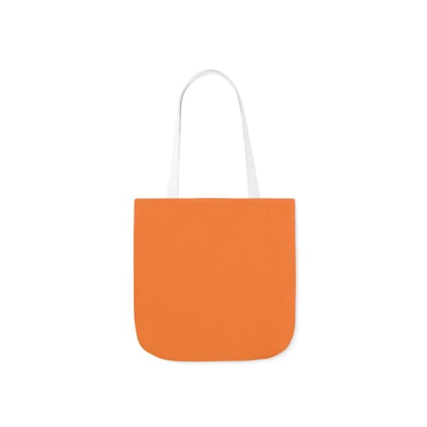 A bag that is orange and has white handles.