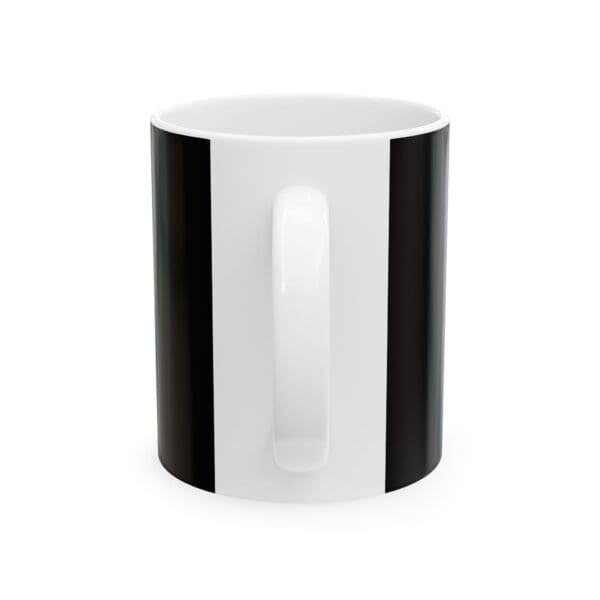 A black and white coffee mug is shown.