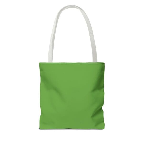 A green tote bag with white handles and an image of a person.