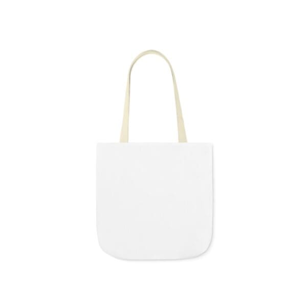 A white bag with two handles on top of it.