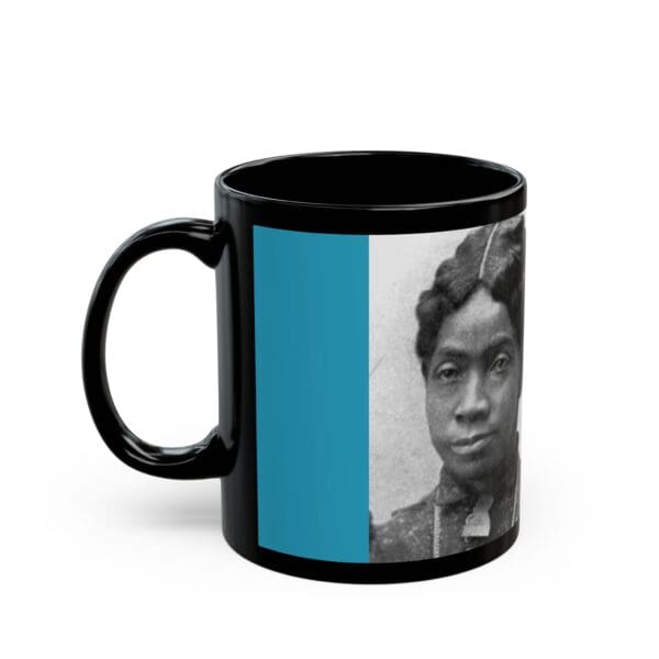 A black coffee mug with an image of a person.