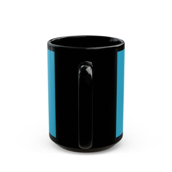 A black and blue mug is sitting on the table.